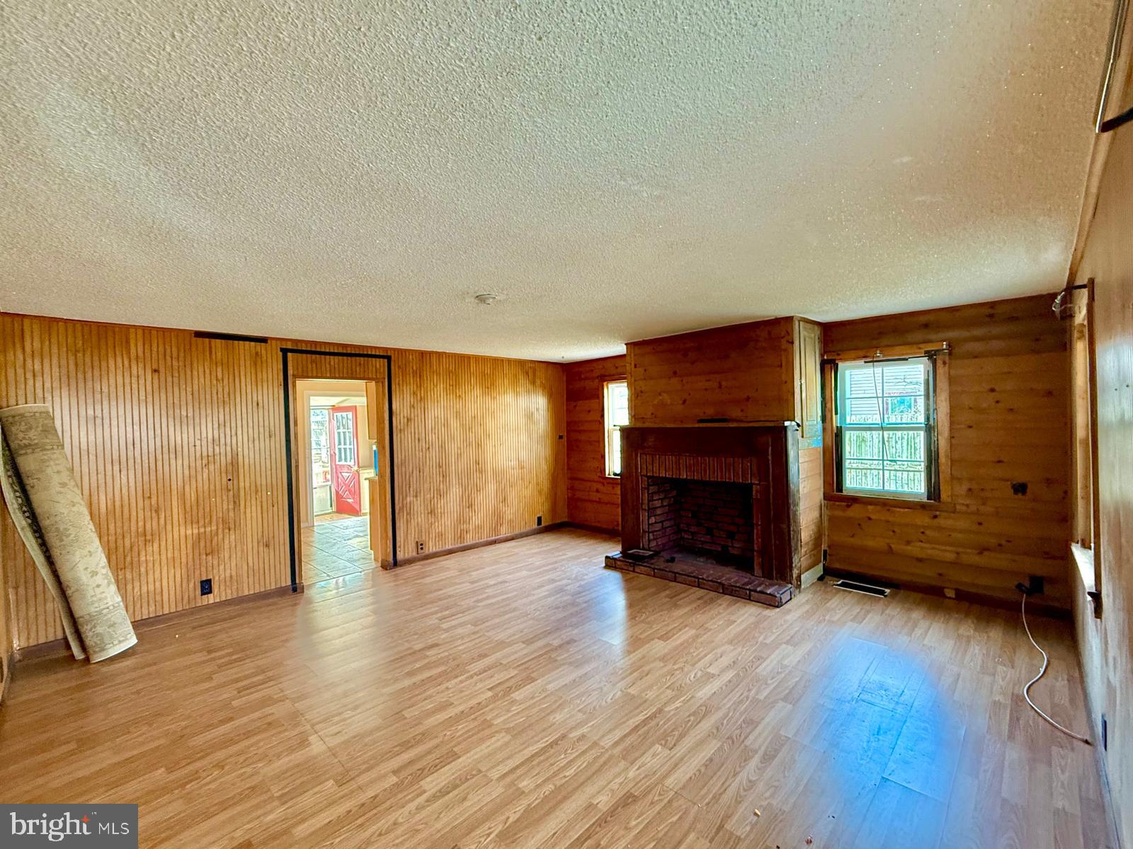 73 Maple Avenue Cedarville, NJ 08311 - Photo 5 of 25 an empty room with furniture and a fireplace