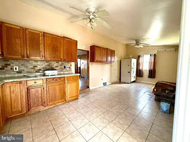 a kitchen with a sink cabinets and appliances