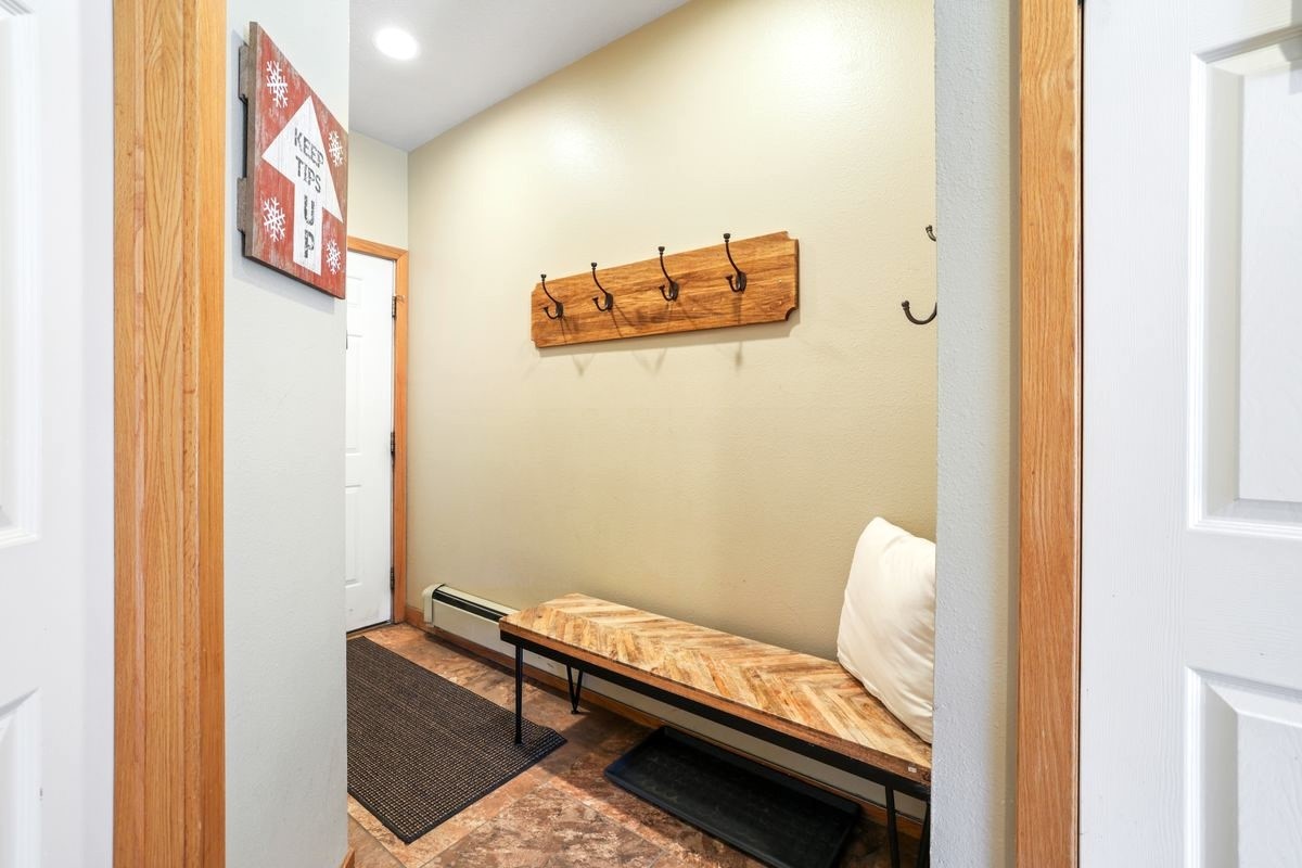 22138 Highway 6, Unit 1553 Keystone, CO 80435 - Photo 14 of 43 a view of a hallway with chairs