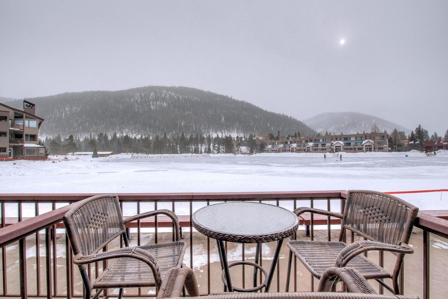 22138 Highway 6, Unit 1553 Keystone, CO 80435 - Photo 17 of 43 a view of a lake from a balcony with furniture