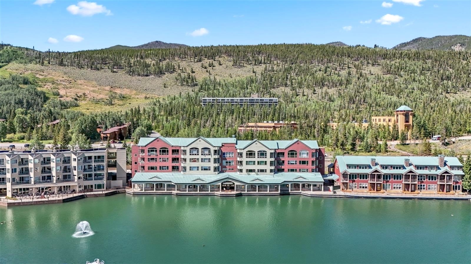 22138 Highway 6, Unit 1553 Keystone, CO 80435 - Photo 29 of 43 a view of a city with swimming pool and mountains