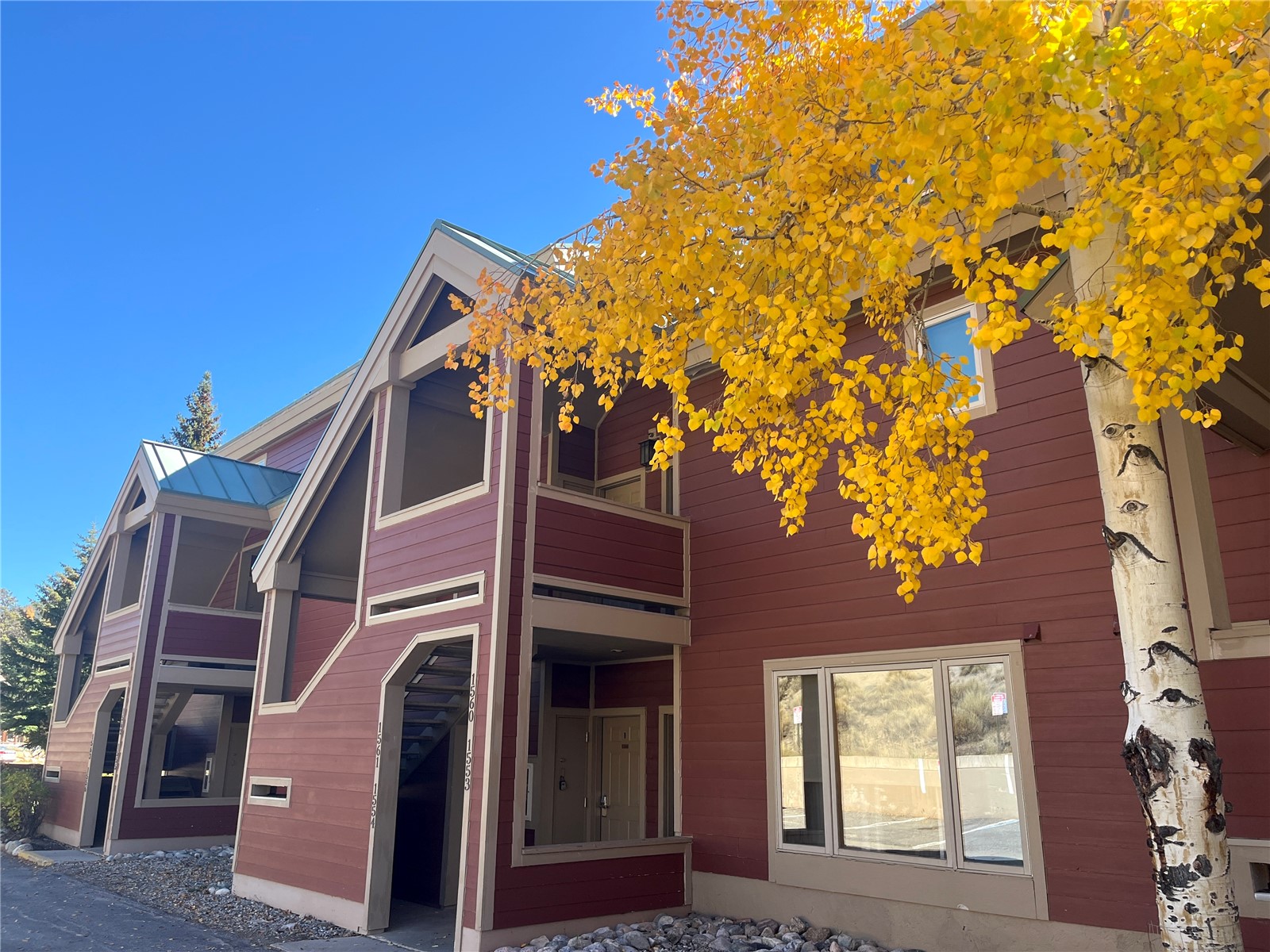 22138 Highway 6, Unit 1553 Keystone, CO 80435 - Photo 3 of 43 a view of a house with a tree