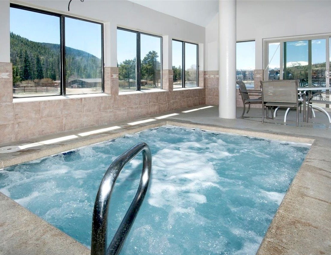 22138 Highway 6, Unit 1553 Keystone, CO 80435 - Photo 37 of 43 a view of livingroom with furniture and floor to ceiling window