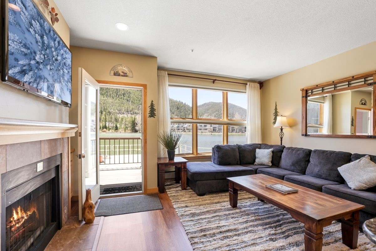 22138 Highway 6, Unit 1553 Keystone, CO 80435 - Photo 4 of 43 a living room with furniture and a fireplace