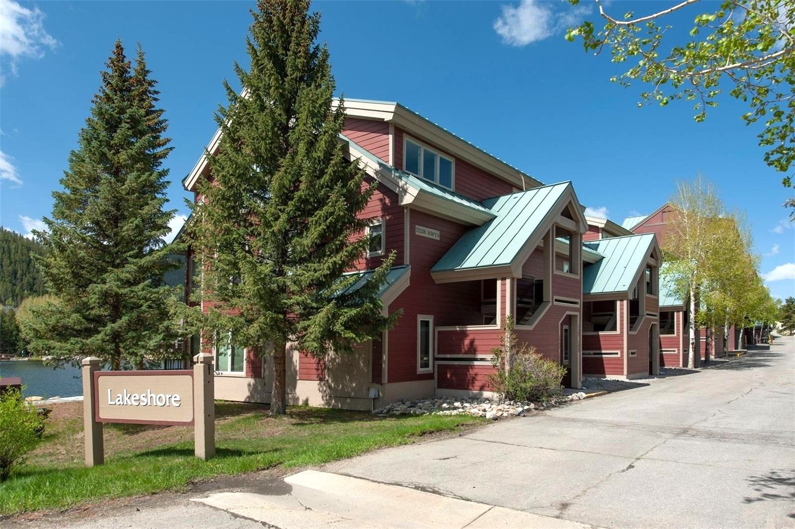 22138 Highway 6, Unit 1553 Keystone, CO 80435 - Photo 7 of 43 a front view of a house with a yard