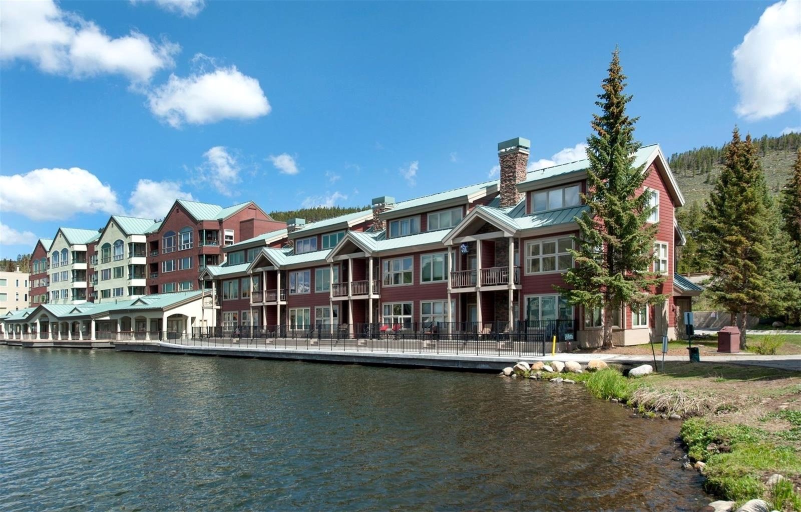 22138 Highway 6, Unit 1553 Keystone, CO 80435 - Photo 8 of 43 a view of a lake with a house