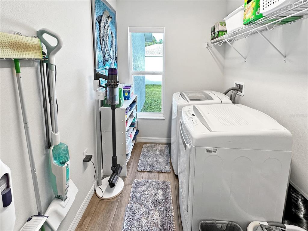 13023 Downy Woodpecker Road Weeki Wachee, FL 34614 - Photo 19 of 43 a utility room with dryer and washer