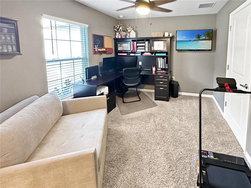 13023 Downy Woodpecker Road Weeki Wachee, FL 34614 - Photo 10 of 43 a living room with furniture and a window