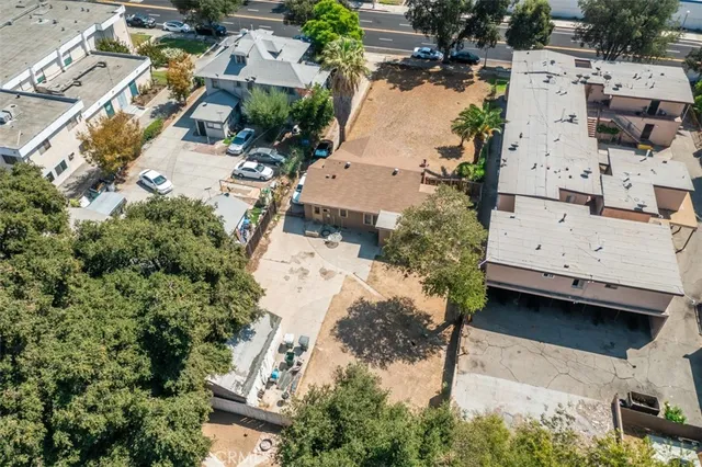 an aerial view of residential houses with outdoor space