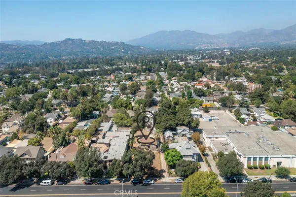 an aerial view of residential houses and street space