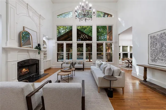 a living room with furniture fireplace and window