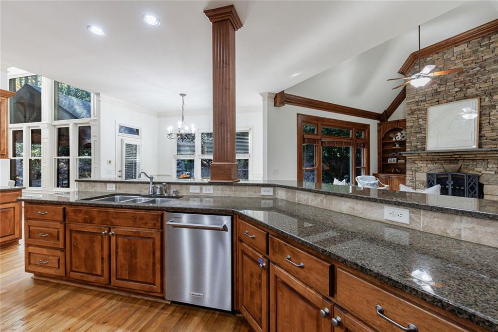 2893 Thurleston Lane Duluth, GA 30097 - Photo 20 of 53 a kitchen with stainless steel appliances granite countertop wooden cabinets a sink and dishwasher