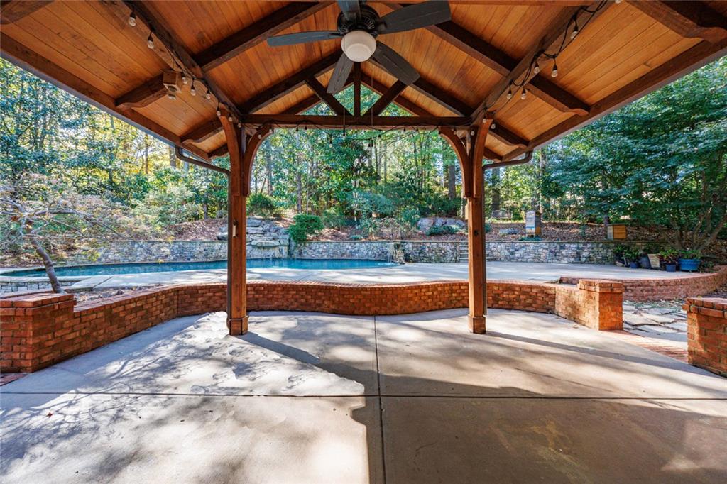 2893 Thurleston Lane Duluth, GA 30097 - Photo 26 of 53 a view of a patio with a table and chairs under an umbrella