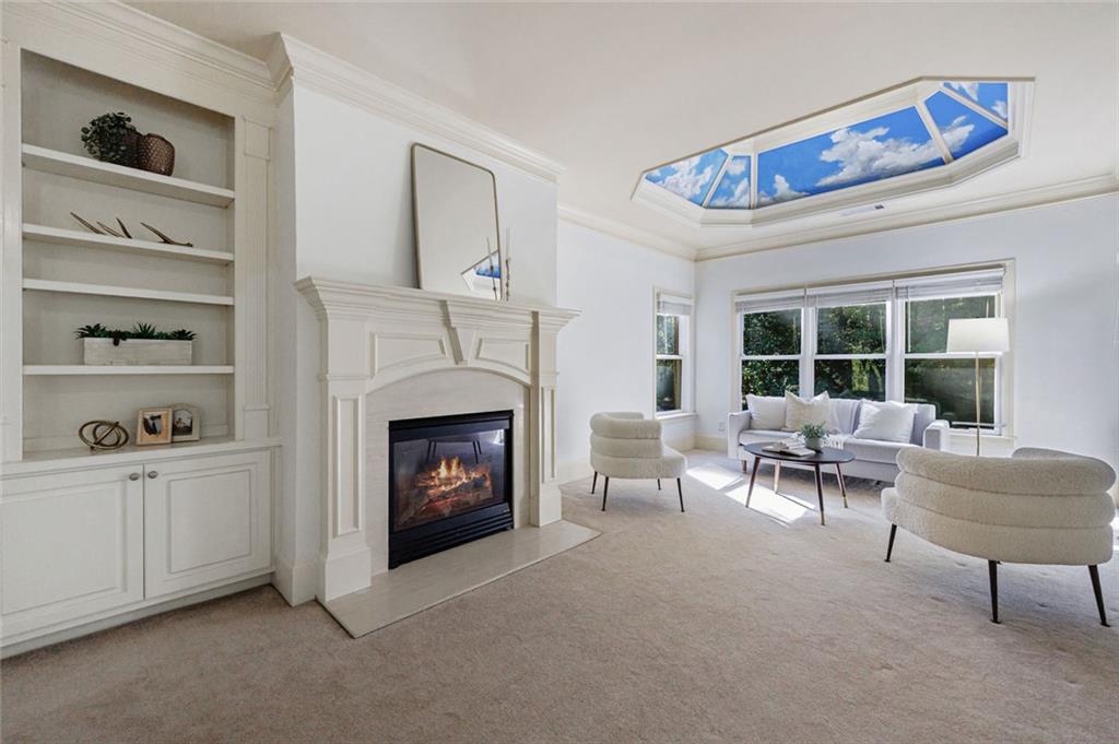 2893 Thurleston Lane Duluth, GA 30097 - Photo 39 of 53 a living room with furniture a fireplace and a large window