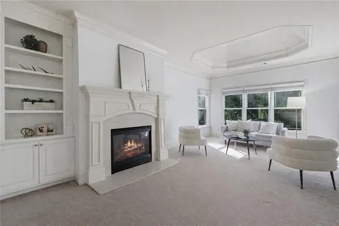 a view of a livingroom with a furniture and cabinet