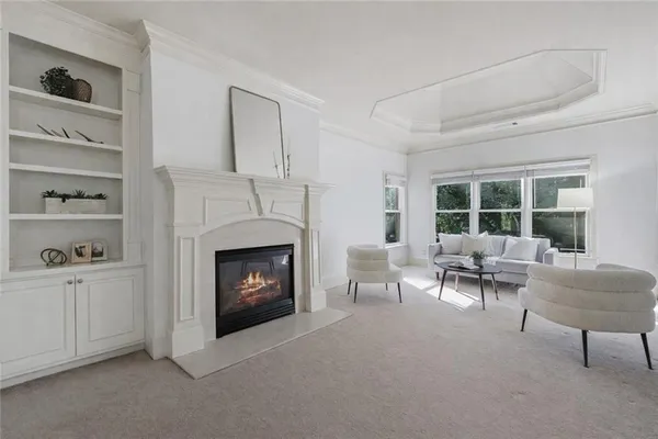 a view of a livingroom with a furniture and cabinet