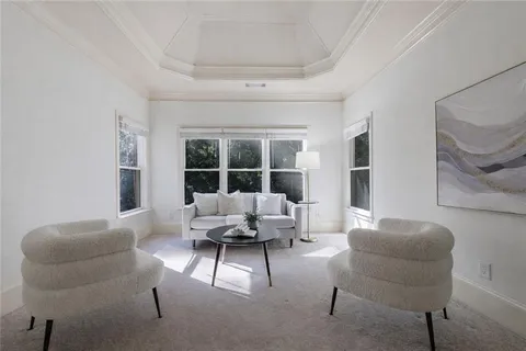 a bathroom with a granite countertop tub sink shower and mirror