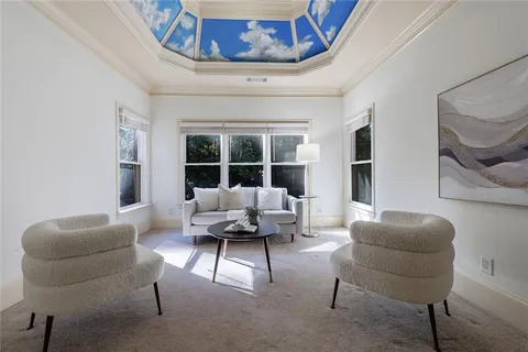 a bath tub sitting in a bathroom next to a window