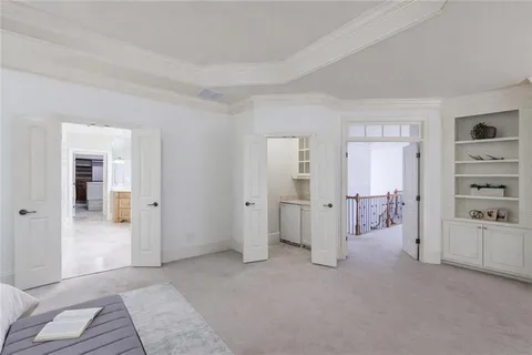 a bath tub sitting in a bathroom next to a window