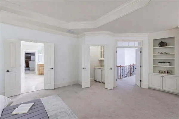 a bath tub sitting in a bathroom next to a window