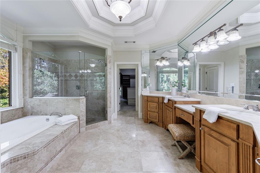 2893 Thurleston Lane Duluth, GA 30097 - Photo 42 of 53 a large spacious bathroom with a granite countertop tub sink shower and mirror