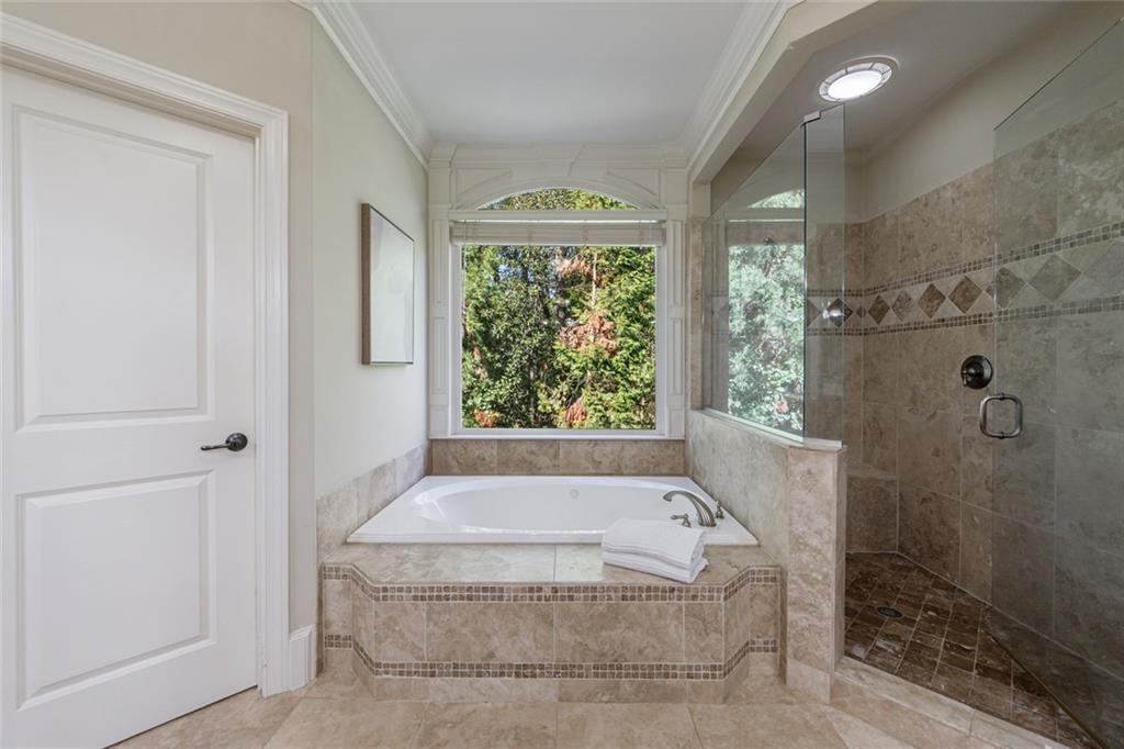 2893 Thurleston Lane Duluth, GA 30097 - Photo 43 of 53 a bath tub sitting in a bathroom next to a window