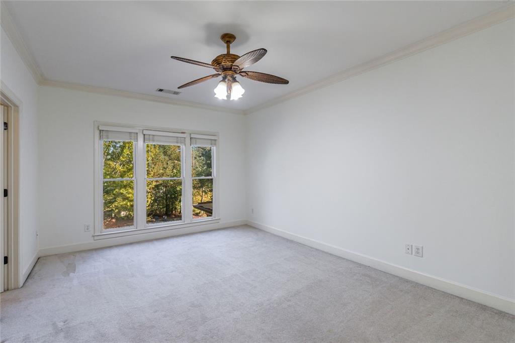 2893 Thurleston Lane Duluth, GA 30097 - Photo 45 of 53 an empty room with windows and fan