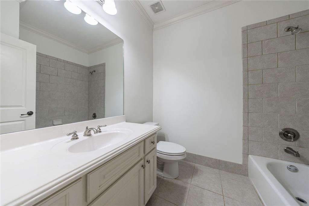 2893 Thurleston Lane Duluth, GA 30097 - Photo 48 of 53 a bathroom with a sink a toilet and shower