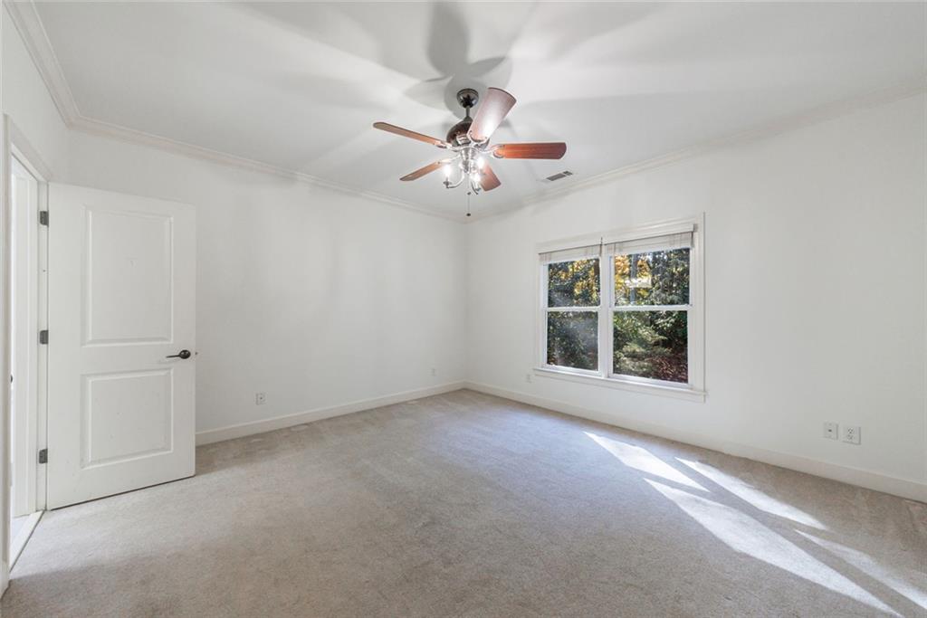 2893 Thurleston Lane Duluth, GA 30097 - Photo 49 of 53 an empty room with windows and fan