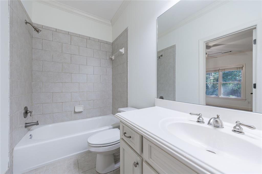2893 Thurleston Lane Duluth, GA 30097 - Photo 50 of 53 a bathroom with a sink a toilet and shower