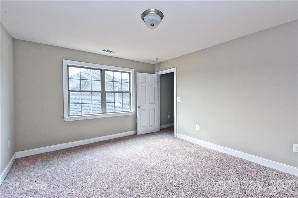 3317 Sincerity Road, Unit 10 Monroe, NC 28110 - Photo 22 of 27 an empty room with windows