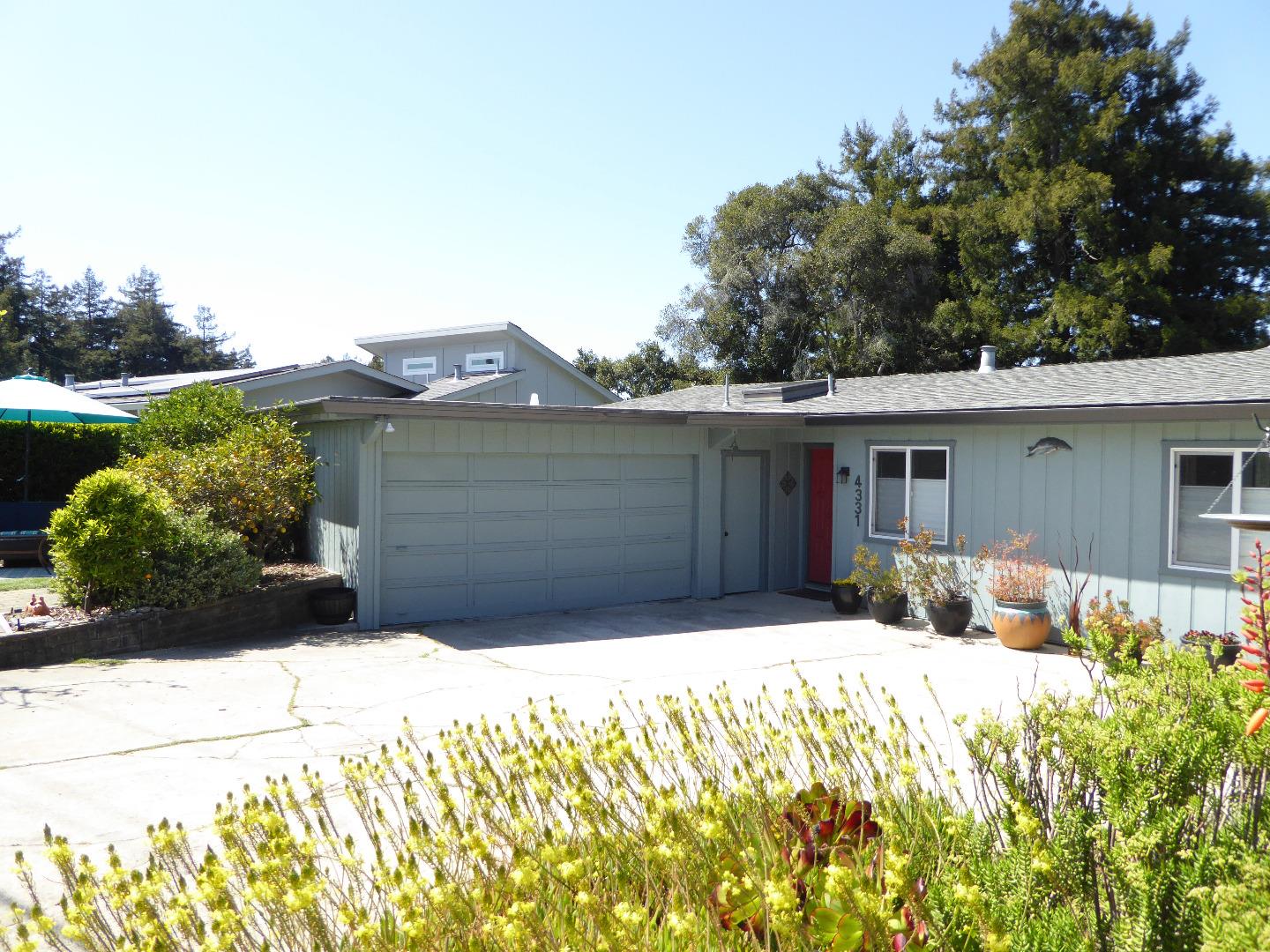 4331 Fairway Drive Soquel, CA 95073 - Photo 1 of 1 a front view of a house with a yard and garage
