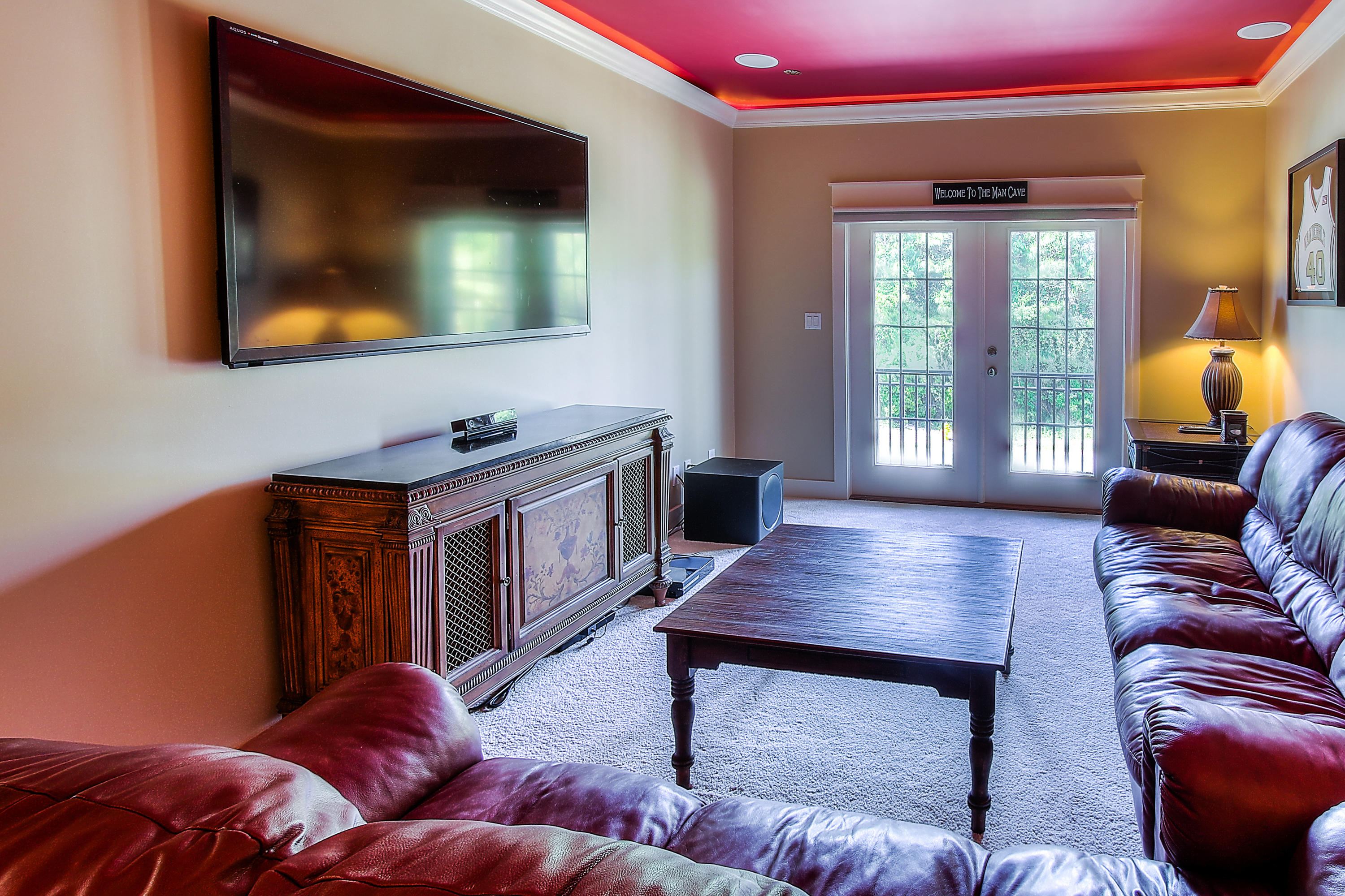 512 West Harborview Road Santa Rosa Beach, FL 32459 - Photo 26 of 40 a living room with furniture and a flat screen tv