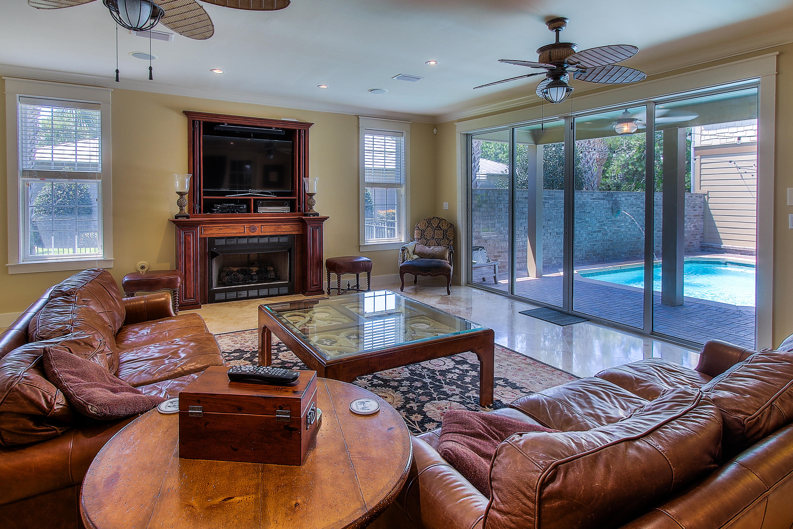 512 West Harborview Road Santa Rosa Beach, FL 32459 - Photo 6 of 40 a living room with fireplace furniture and a flat screen tv
