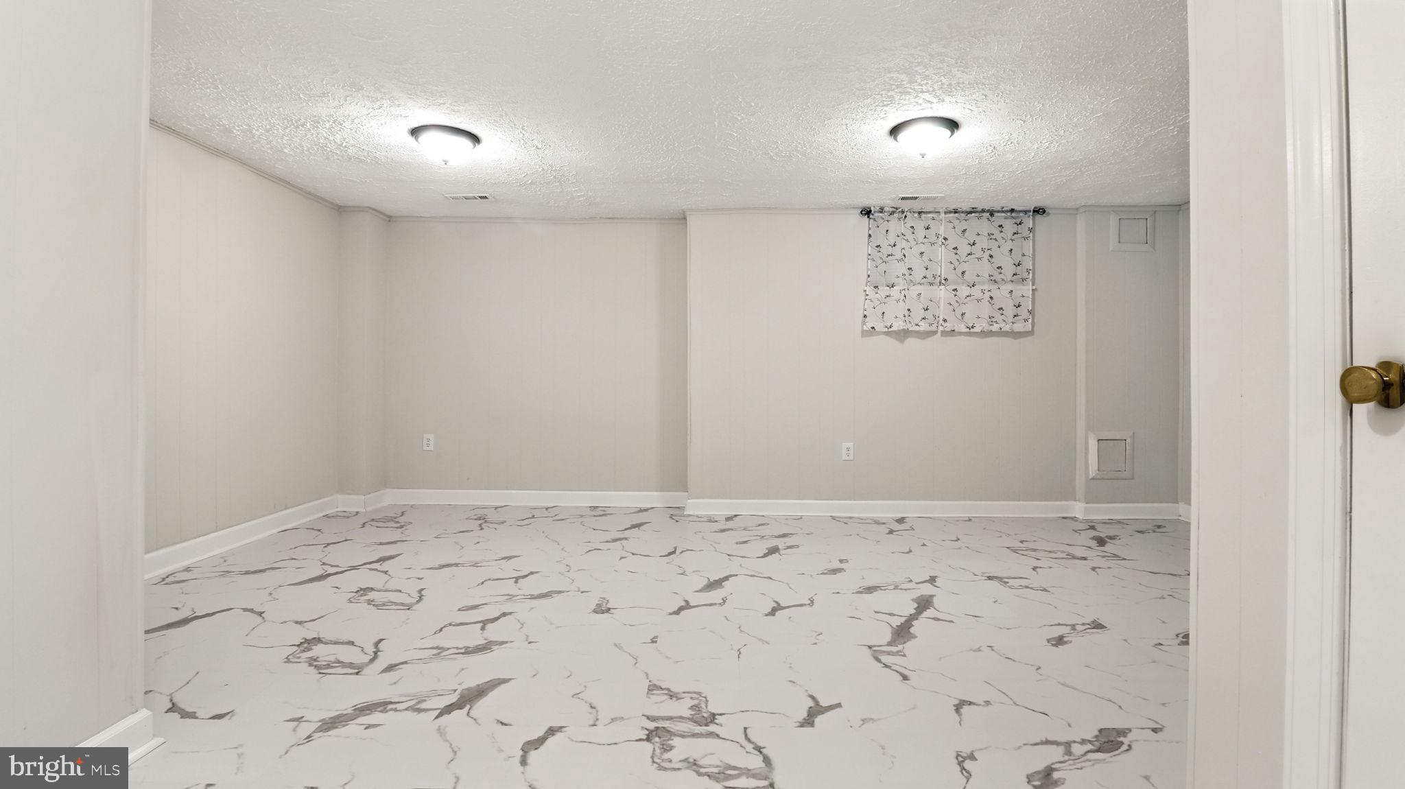 17 Bannock Court Randallstown, MD 21133 - Photo 31 of 40 Spacious Basement with New Tiles