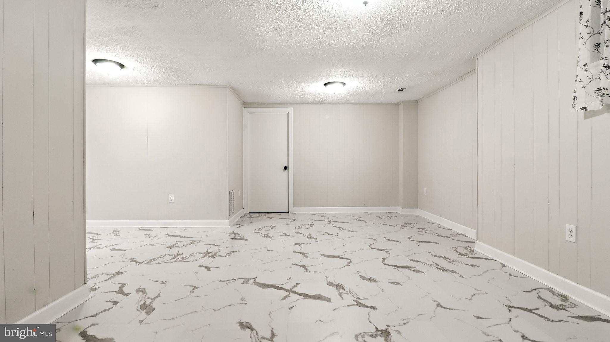 17 Bannock Court Randallstown, MD 21133 - Photo 33 of 40 Spacious Basement with New Tiles