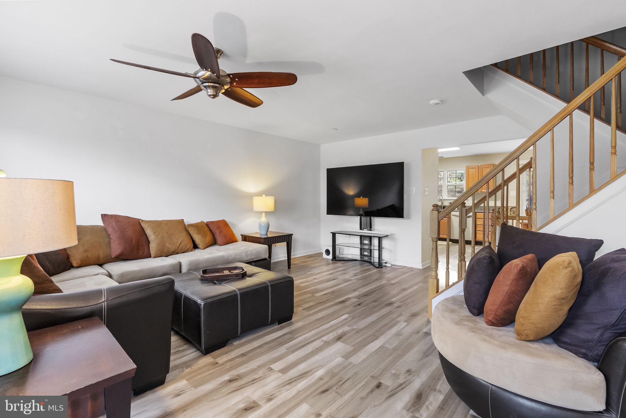 27 Branford Way Coatesville, PA 19320 - Photo 14 of 44 a living room with furniture ceiling fan and a wooden floor