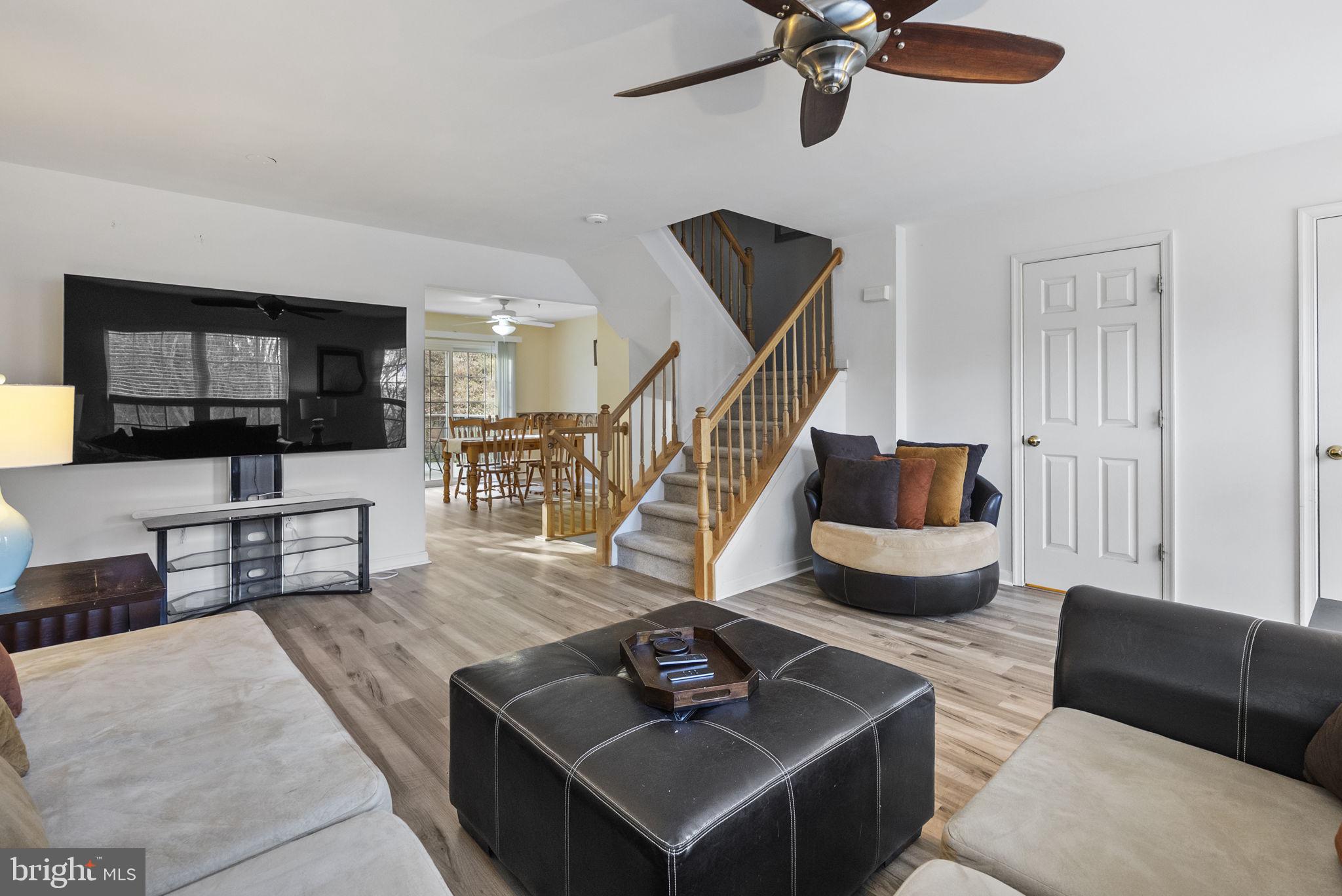 27 Branford Way Coatesville, PA 19320 - Photo 16 of 44 a living room with furniture and a wooden floor