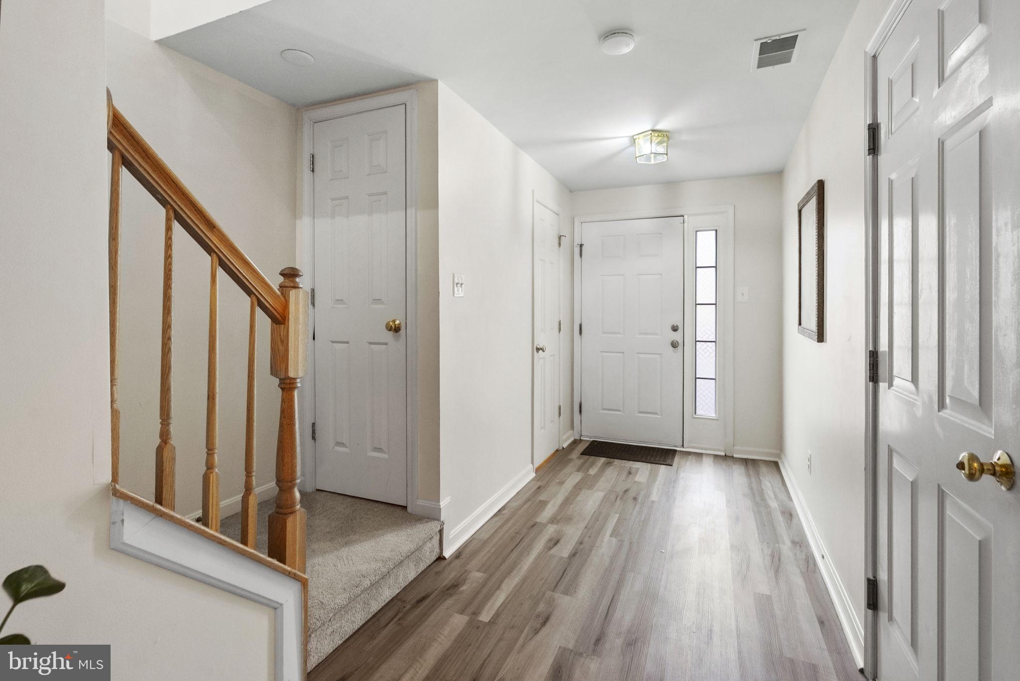27 Branford Way Coatesville, PA 19320 - Photo 19 of 44 a view of a hallway with wooden floor and staircase