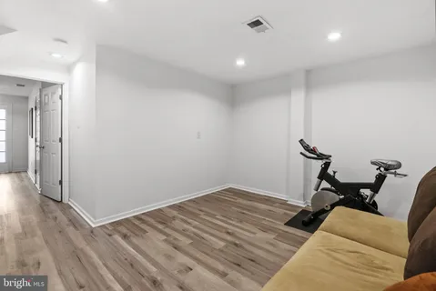 a bathroom with a sink a mirror and shower