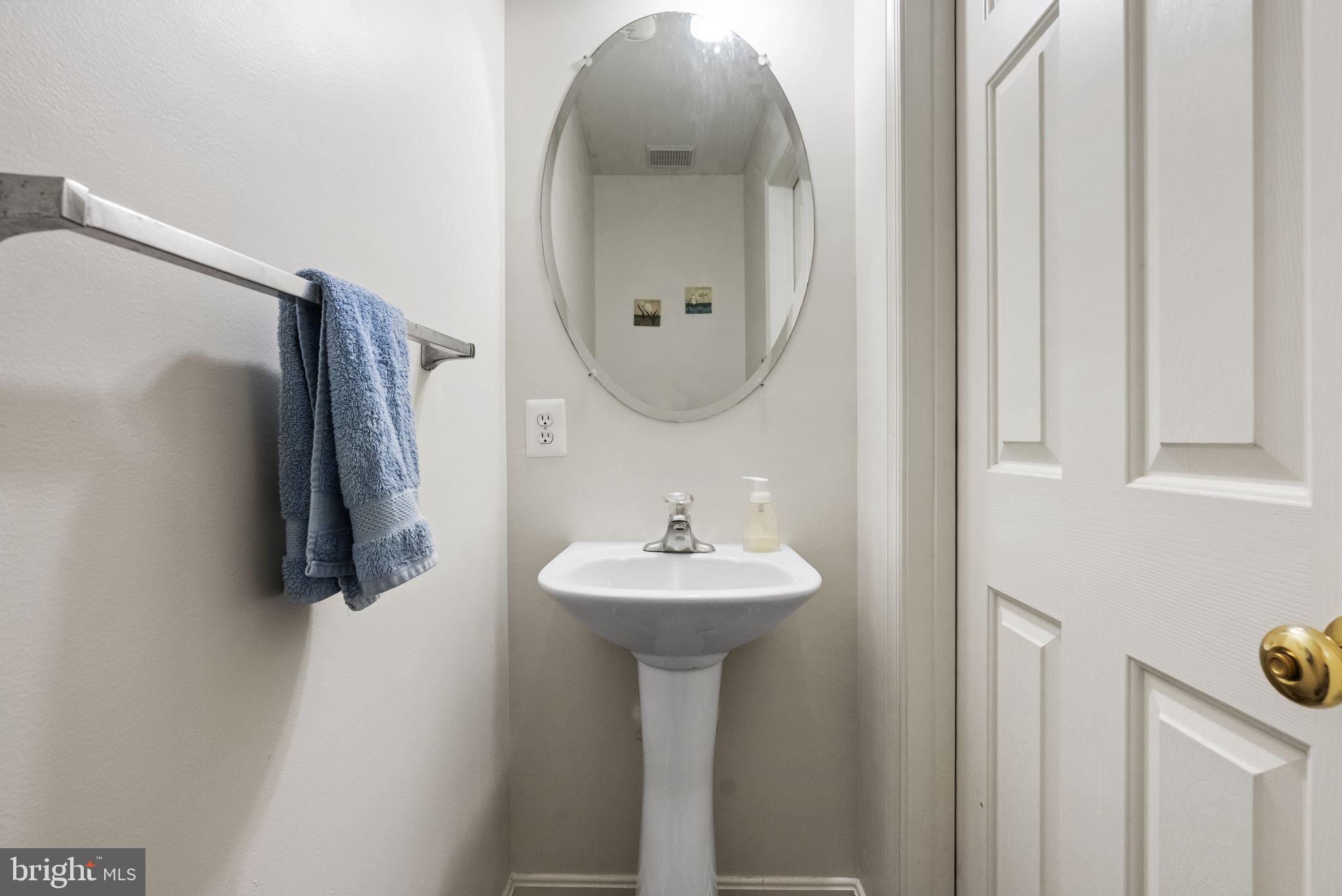 27 Branford Way Coatesville, PA 19320 - Photo 23 of 44 a bathroom with a sink a mirror and shower