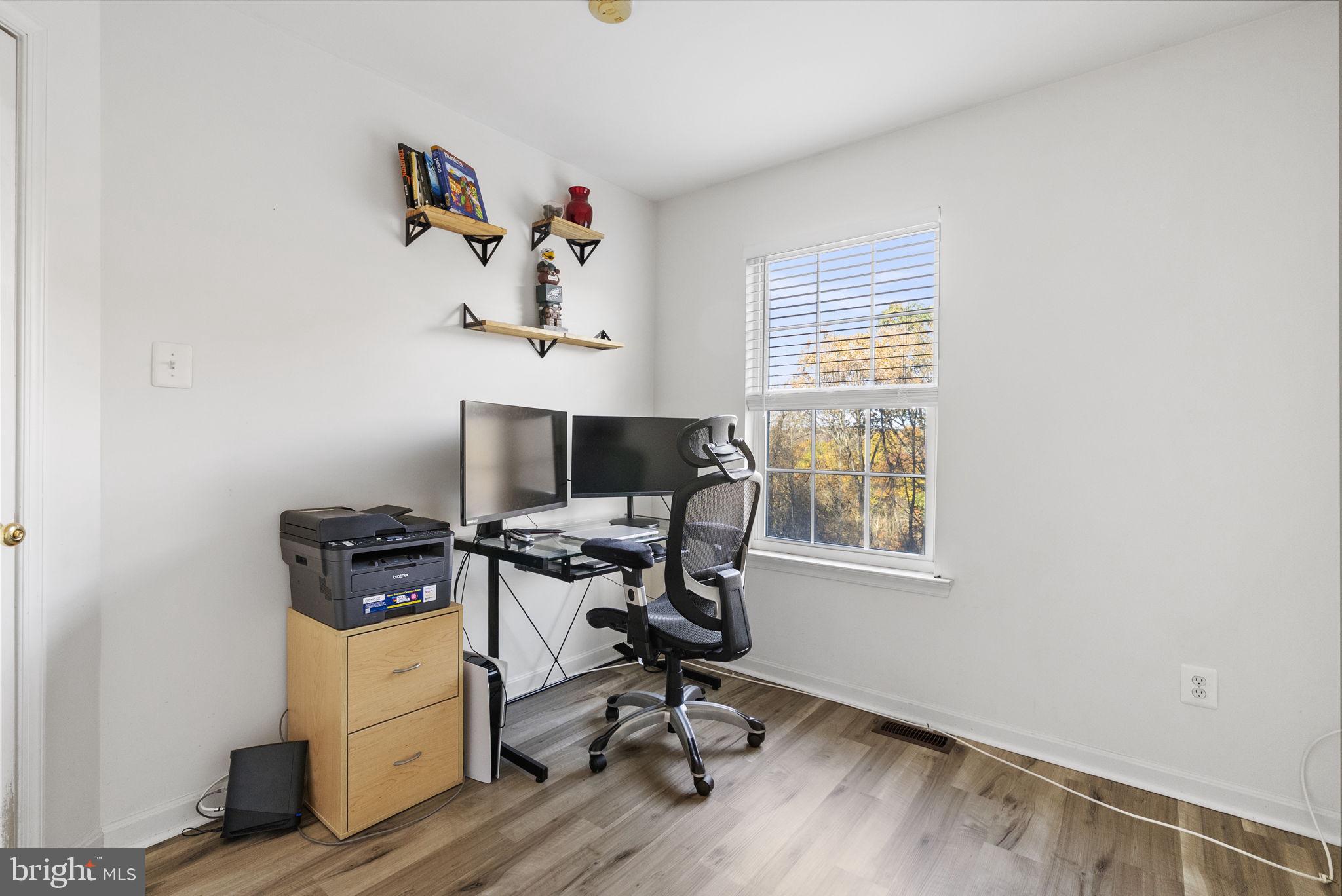 27 Branford Way Coatesville, PA 19320 - Photo 31 of 44 a view of workspace with wooden floor windows