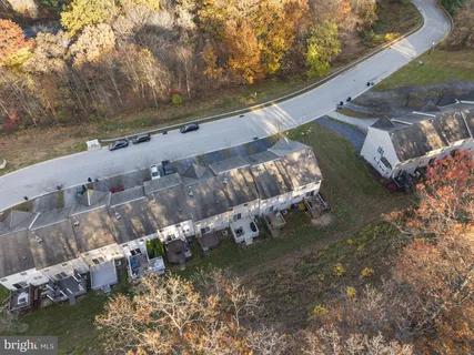 a picture of a bench in front of a building