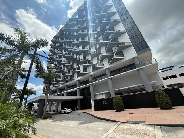a view of a park with swings and slides