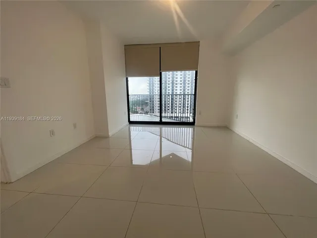 a view of an empty room and window