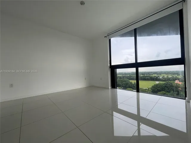 a living room with furniture and window