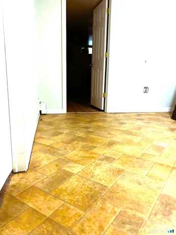 a living room with furniture and flowers