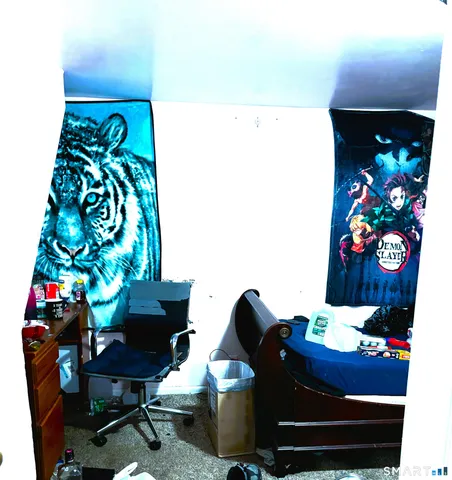 a living room with furniture and flowers