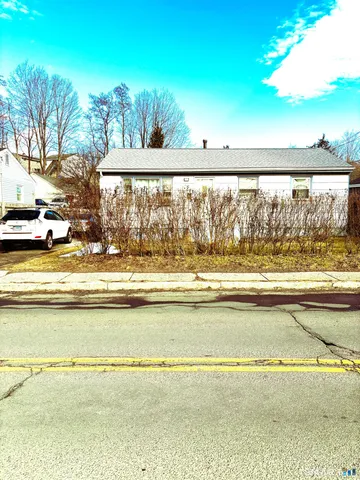 a view of a swimming pool and a yard