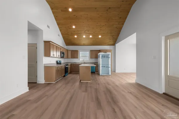 a view of a kitchen with wooden floor